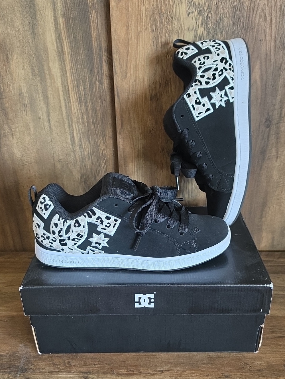 DC Black and White Women's Lace-Up Skate Sneakers with Leopard Logo Adult
